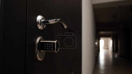 Photo for Door to the apartment with a combination lock. Keyless entry - Royalty Free Image