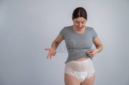 Foto de A woman in adult diapers. Urinary incontinence problem - Imagen libre de derechos
