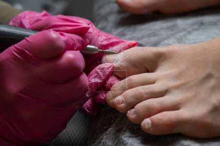 Photo for The master makes hardware pedicures to the client - Royalty Free Image