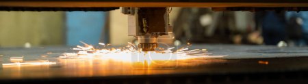 Photo for CNC machine. Laser cutting of metal. Sparks. Widescreen - Royalty Free Image