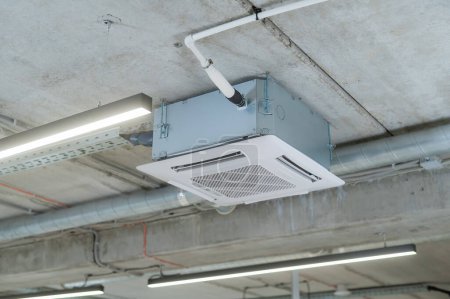 Industrial air conditioner in the office on a concrete ceiling