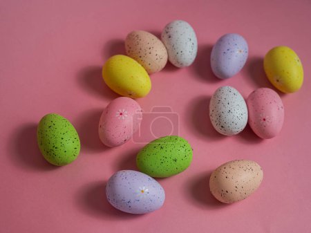 Photo for Painted quail eggs on a pink background. Easter decorations - Royalty Free Image