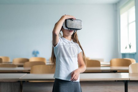 Caucasian schoolgirl wearing virtual reality glasses in the classroom
