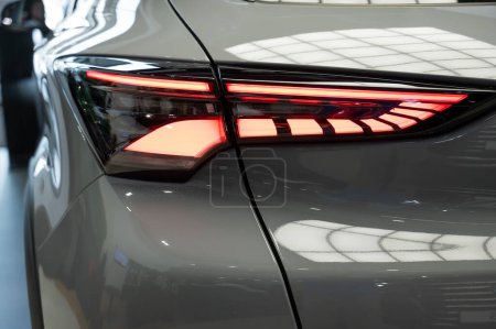 Close-up of the taillight of a white modern car