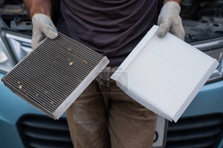 Photo for The master changes the cabin air filter of the car - Royalty Free Image