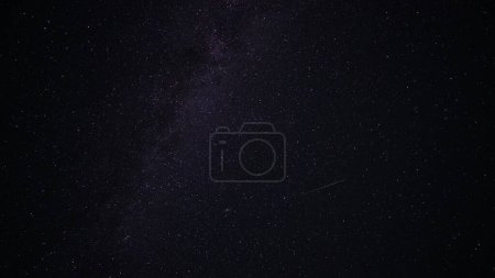 Photo for The Milky Way with falling meteorites. Space. A bright colored stripe is a trace of a meteorite. Nebulae and constellations are visible. Andromeda glows brightly. Astrophotography - Royalty Free Image