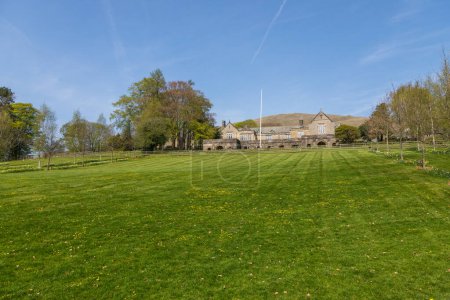 View if the buildings of the Sedbergh village. School playground. Sunny spring day. Sedbergh, Yorkshire Dales, UK.