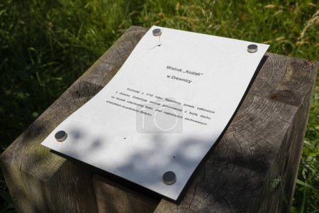 Photo for Drewnica, Zulawy, Poland - 15 June 2019: Information board about the Dutch type windmill in open-air museum. - Royalty Free Image