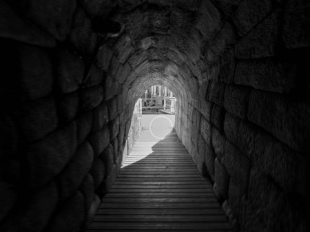 Photo for Black and white photo of an entrance to the Roman Amphitheater of Merida, in Spain. Tourism concept. - Royalty Free Image