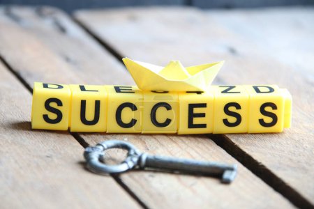 Photo for Key to success creative concept. Lettering from yellow cubes. - Royalty Free Image