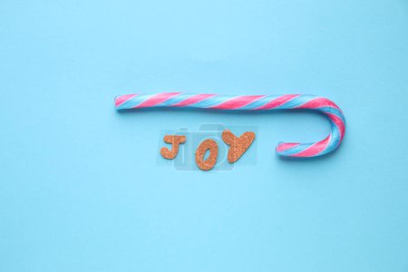 Photo for Merry Christmas creative card. The inscription is joy and Candy cane. - Royalty Free Image