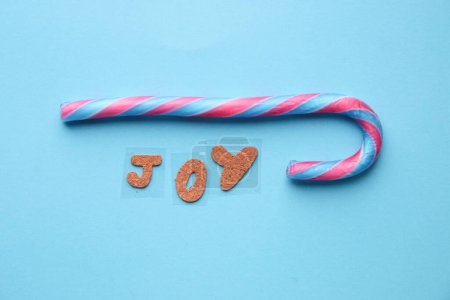 Photo for Merry Christmas creative card. The inscription is joy and candy cane. - Royalty Free Image