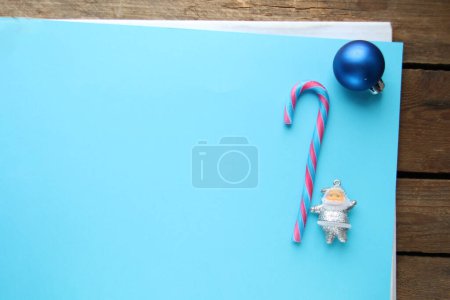 Photo for Merry Christmas creative card. Santa Claus and candy cane. - Royalty Free Image