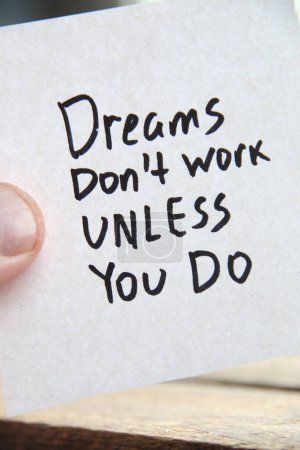 Photo for Motivational quotes inscription on a tag. Dreams dont work unless you do. - Royalty Free Image