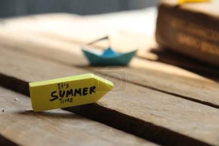 Photo for Its Summer time concept origami paper boat and tag. - Royalty Free Image