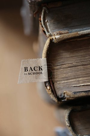 Photo for Back to school tag and Old books on a wooden shelf. - Royalty Free Image