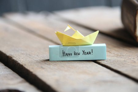 Photo for Happy New year concept. Paper ship and tag. - Royalty Free Image