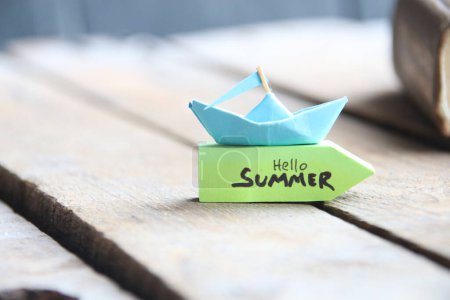 Photo for Origami paper boat and tag Hello Summer. - Royalty Free Image