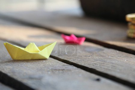 Photo for Origami made paper sailing boat. Summer time concept. - Royalty Free Image