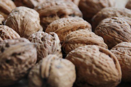 Photo for Healthy food. Walnuts on a old vintage kitchen table. - Royalty Free Image