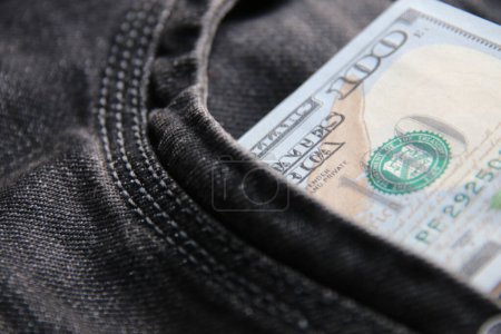 Photo for Dollars in a jeans pocket, closeup. - Royalty Free Image