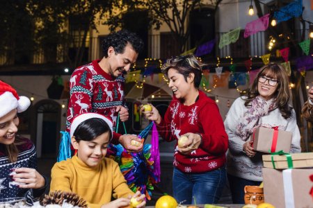 Mexican Posada, Hispanic family Singing carols in Christmas celebration in Mexico Latin America-stock-photo