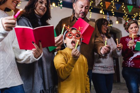 Mexican Posada, hispanic family Singing carols in Christmas celebration in Mexico Latin America culture and traditions