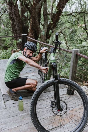 Photo for Hispanic Senior man on his mountain bike cycling outdoors in Mexico Latin America - Royalty Free Image