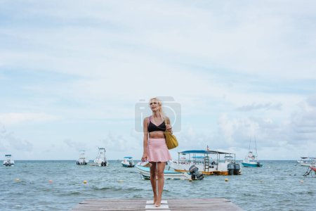 Photo for Portrait of young transgender woman wearing woman makeup at the beach in Mexico Latin America, hispanic lgbt community - Royalty Free Image