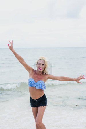 Photo for Portrait of young transgender woman at the beach in Mexico Latin America, hispanic lgbt community - Royalty Free Image