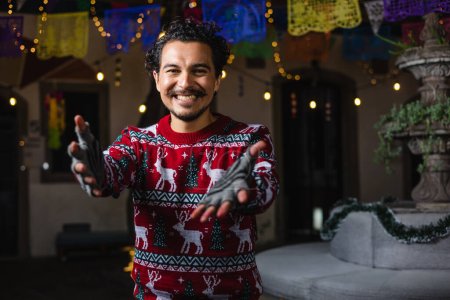 Hispanic young man portrait at traditional posada party for Christmas celebration in Mexico Latin America