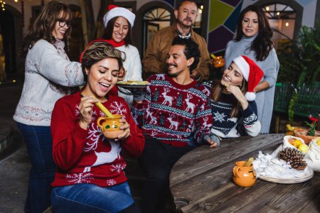 Photo for Latin Family celebrating mexican posadas for Christmas eve in Mexico Latin America, traditional party in holidays - Royalty Free Image