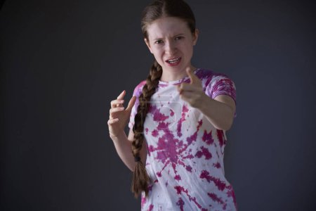 Photo for Studio Portrait Of Angry And Frustrated Teenage Girl Shouting At Camera - Royalty Free Image