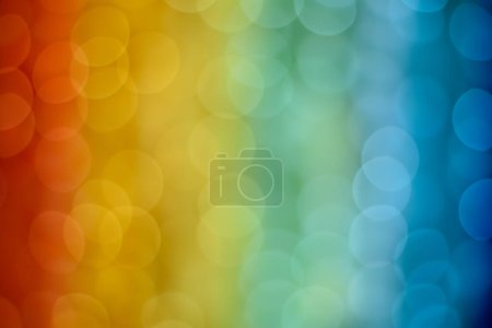 Abstrakter Hintergrund mit Bokeh in Regenbogenfarben. Große Größe des Bokeh. Nahaufnahme