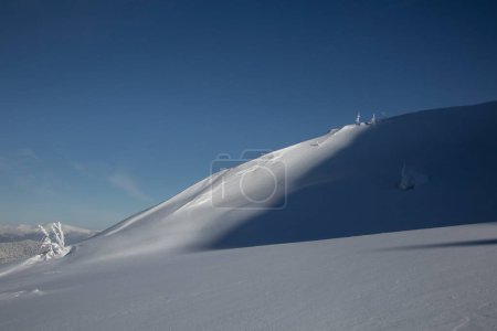 Photo for A snowy mountain slope in the Carpathian Mountains. Winter mountains landscape outdoor concept - Royalty Free Image
