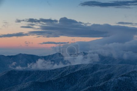 Photo for Spectacular sunset over winter mountains covered with snowy spruce forest, winter in the Carpathians. Idyllic winter wallpaper. - Royalty Free Image