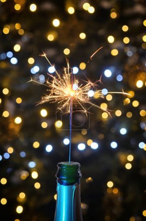 Photo for Closeup Champagne Wine with Sparkler on New Year - Royalty Free Image