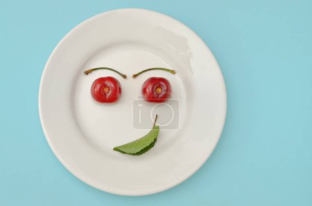 Photo for Abstract Healthy Cherry Smile on Plate - Royalty Free Image