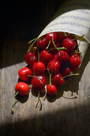 Photo for Closeup Cherry Fruits on Wooden Table - Royalty Free Image