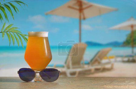 Photo for Glass of Lager Beer On Bar Counter on Beach - Royalty Free Image