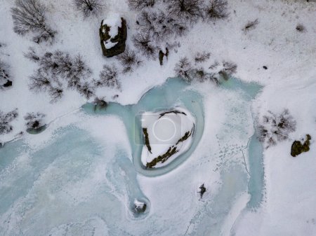 Foto de Drone aerial top view of Winter landscape in Lofoten Islands, Norway. Color horizontal photography with amazing abstract effect. Snow and ice in wild nature. - Imagen libre de derechos