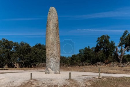 Photo for The Menhir of Meada is single standing stone near Castelo de Vide in Portugal. - Royalty Free Image