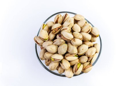 Pistachios in a glass bowl.