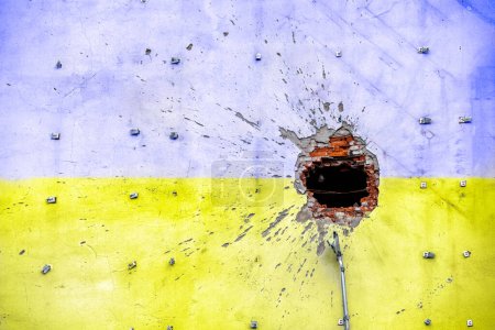 pattern explosion damaged blue yellow house wall war in Ukraine