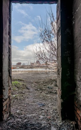 Photo for Inside a destroyed and burnt house overlooking the Azovstal plant war in Ukraine with Russia - Royalty Free Image
