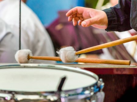 Photo for Male musician drummer hand with drumsticks and drum closeup - Royalty Free Image