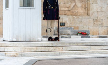 Photo for Greek evzone soldiers in traditional costumes guard of honor at a monument in greece - Royalty Free Image