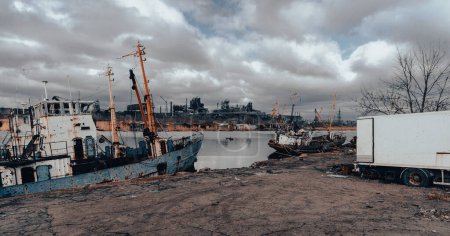 abandoned old damaged ships in the port without people during the war between Ukraine and Russia