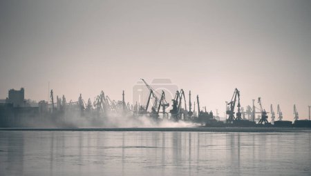 Photo for Smoke after the explosion in the seaport war in Ukraine with Russia - Royalty Free Image