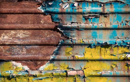 pattern rusty metal surface with remnants of blue and yellow paint paint national colors flag of ukraine